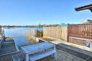 Sitting by the dock of the lake- click for photo gallery